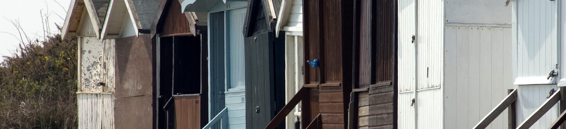 Image of colourful beach huts in Frinton-on-Sea.