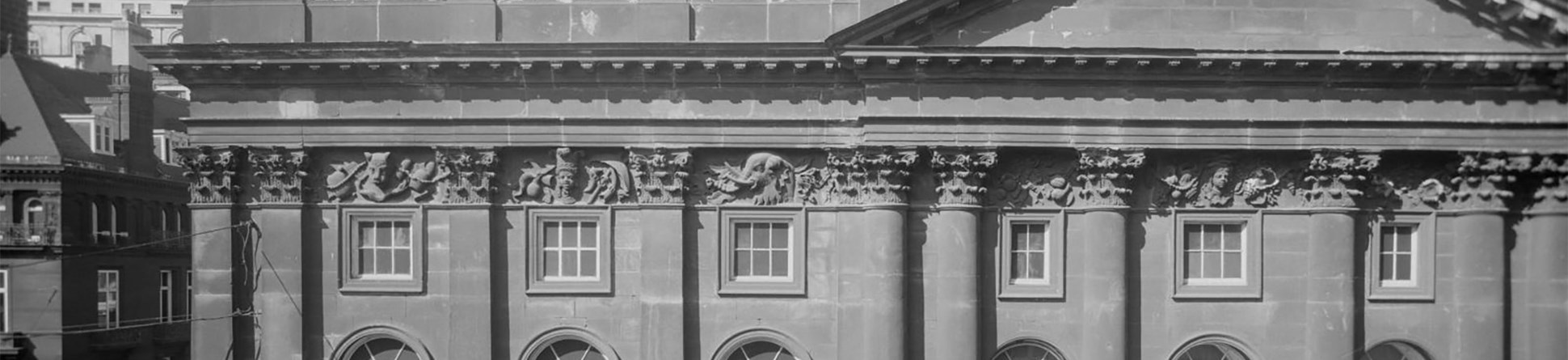 A black and white archive photograph of the exterior facade of Liverpool Town Hall.