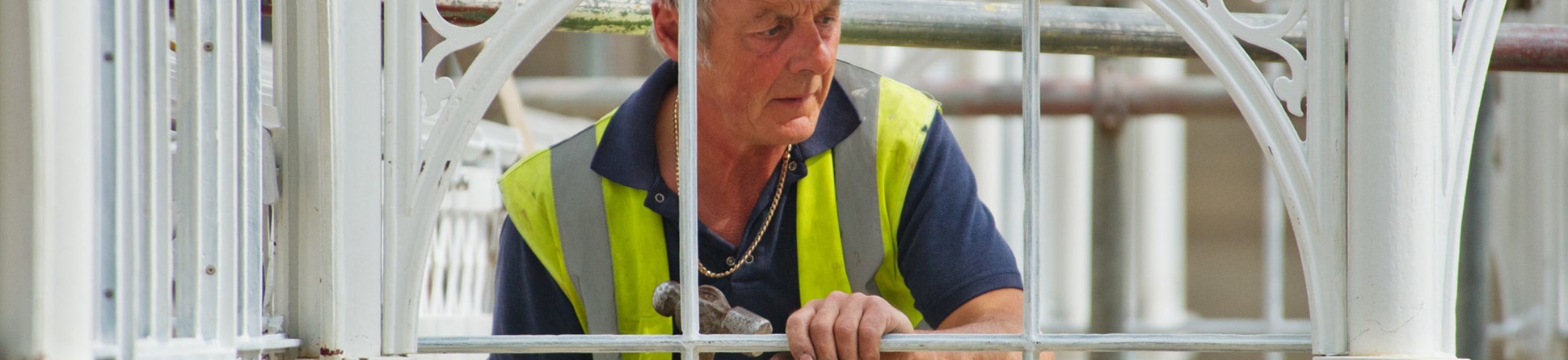 A worker renovating the greenhouse at Wentworth Castle.