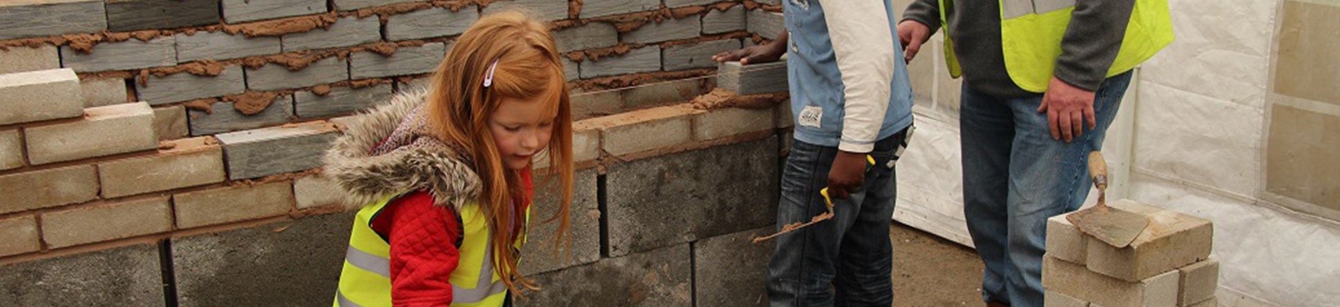 Children enjoying a lime mortar taster day