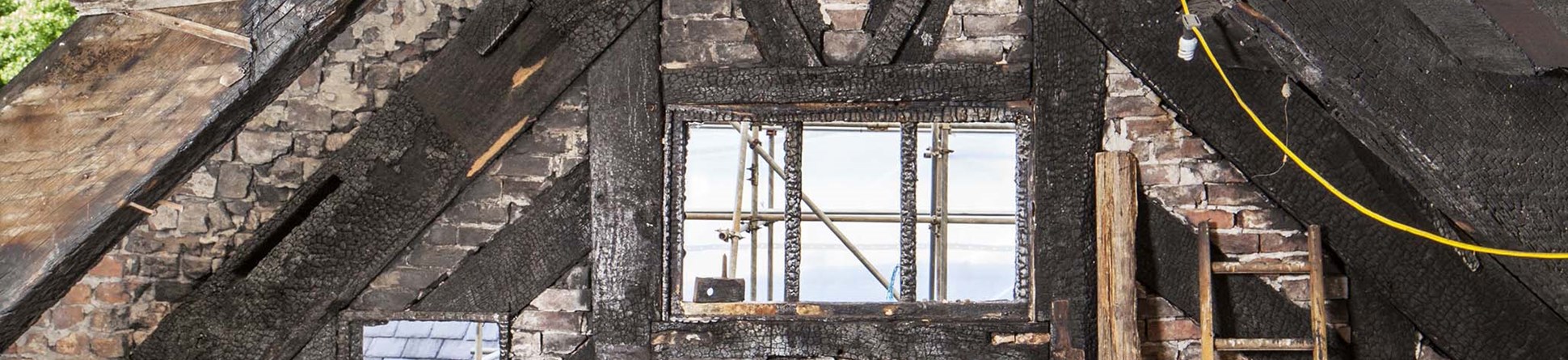 Fire damage up in the roof space of Wythenshawe Hall in Manchester.