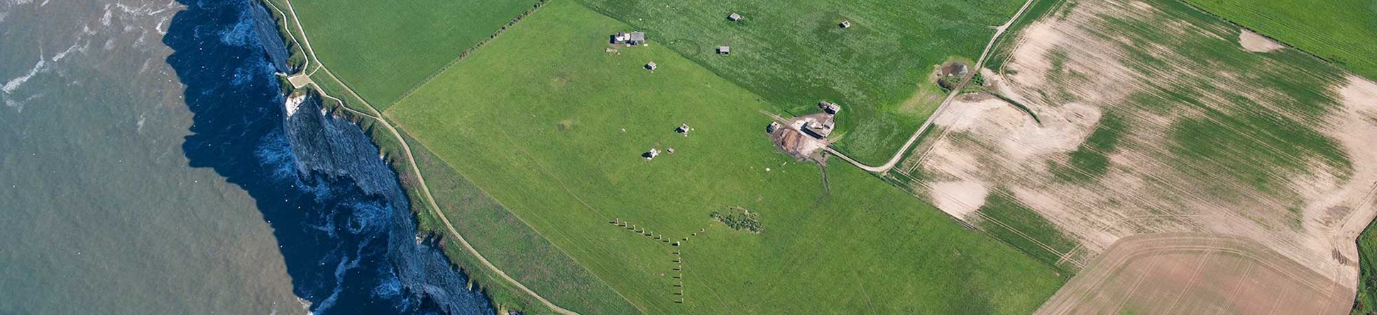 Aerial view of structures and buildings near the cliff edge